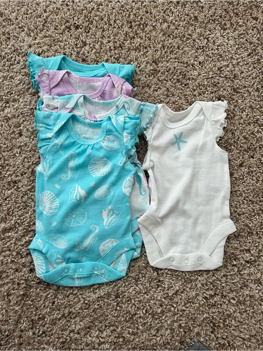 The Children’s Place Newborn 5 Bodysuits & 3 Shorts Set in Pastel Seashell Print